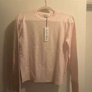 pale pink cashmere sweater. brand new with tags. slight gathering at shoulders.